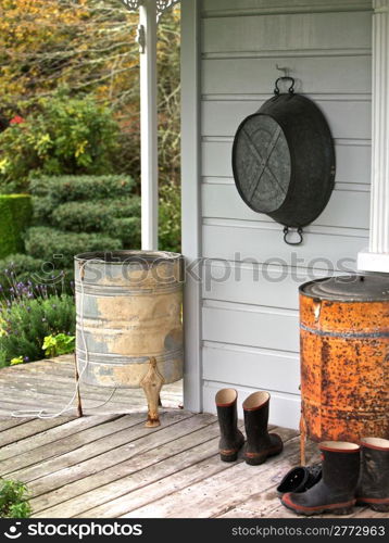 Boots at Entrance to Porch Welcome Home. Farm house, back porch