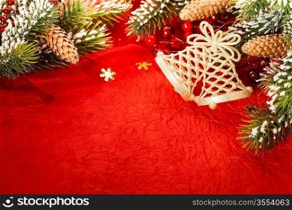 Border from Christmas tree decoration on red paper