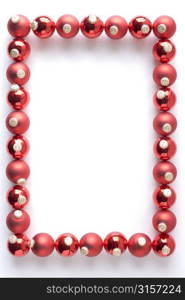 Border Made From Red Baubles Against White Background