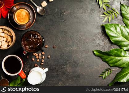 Border of various coffee on dark rustic background (americano, espresso and iced coffee), flat lay, space for text. Border of various coffee