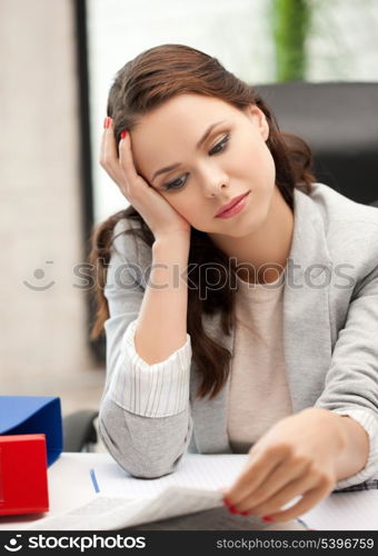 bored and tired woman behid the table