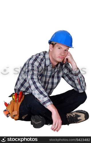 Bored builder sat on the floor