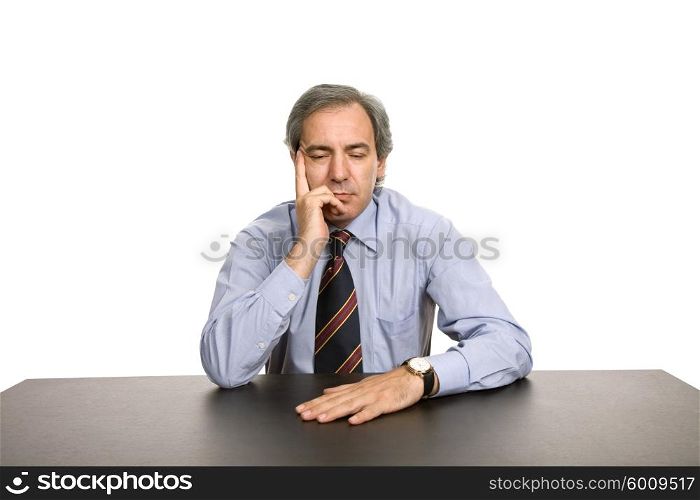 bored business man on a desk, isolated on white