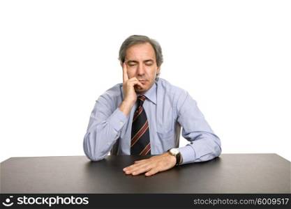 bored business man on a desk, isolated on white