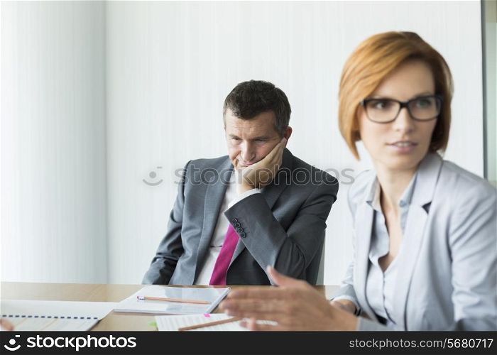 Bored businessman in conference meeting