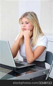 Bored businesswoman in front of computer