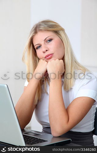 Bored businesswoman in front of computer