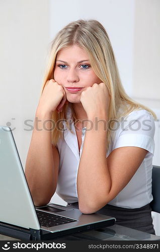 Bored businesswoman in front of computer