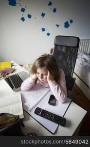 Bored Girl In Bedroom Using Laptop