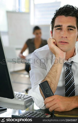 Bored man at his desk