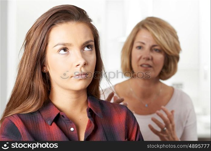 Bored Teenage Girl Being Told Off By Mother