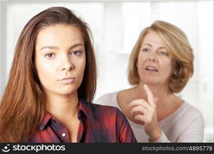 Bored Teenage Girl Being Told Off By Mother