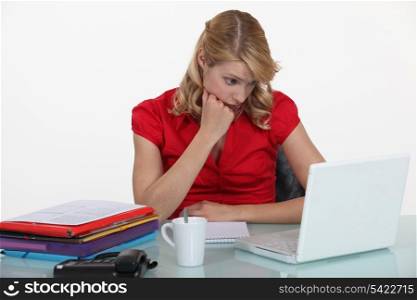 Bored woman in front of computer