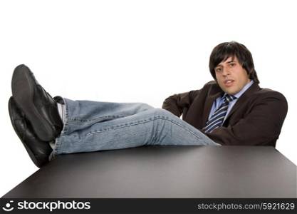 bored young business man on a desk, isolated on white