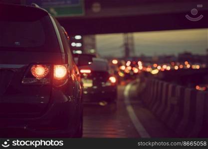 Boring day of heavy traffic jam in dusk sunset Bangkok city, car brake light on the road.