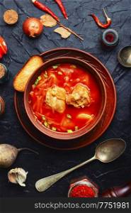 Borscht - hot soup based on beets and meat. Red borscht, traditional dish of Ukrainian cuisine. Delicious red Ukrainian borscht