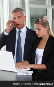 Boss and personal assistant preparing for meeting