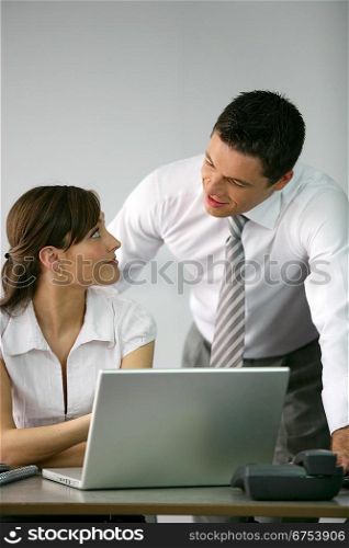 Boss flirting with secretary