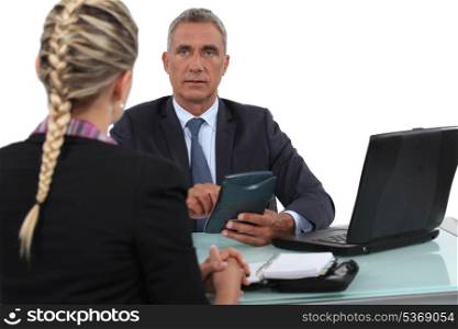 Boss setting agenda with assistant