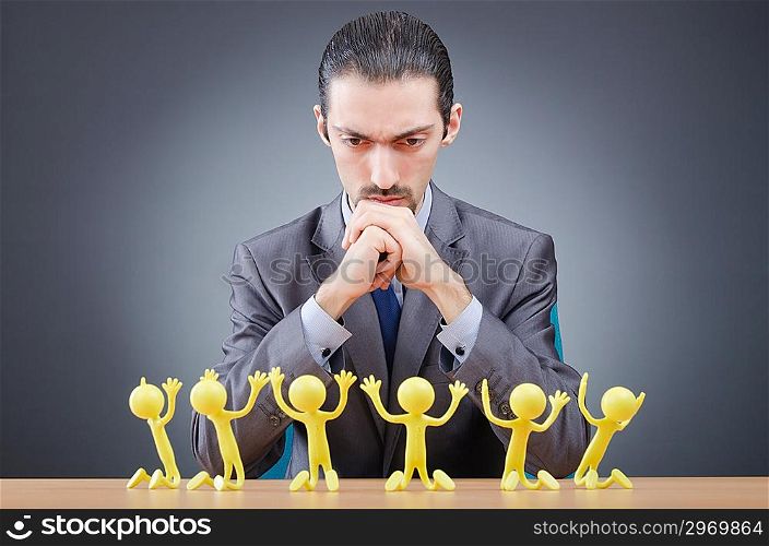 Boss with figures of his subordinates
