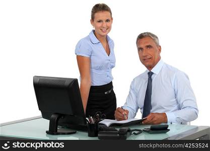 Boss working with female assistant
