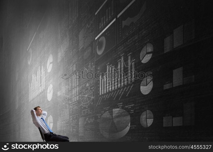 Bossy man in chair. Relaxing businessman sitting in chair with hands on head