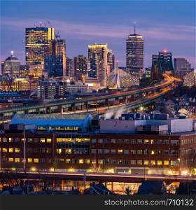 Boston Cityscape with highway trail to Boston MA USA at night.
