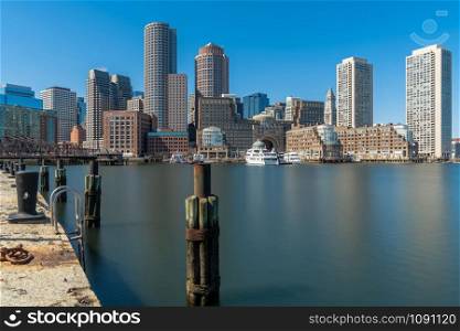 Boston skyline from Fan Pier at the afternoon with smooth water river, Massachusetts, USA downtown skyline, United state of America, Architecture and building with tourist concept