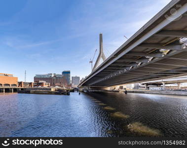 Boston Zakim bridge over Charles river around Boston bay harbor at Boston downtown MA USA. Boston is the capital and most populous cityof the Commonwealth of Massachusetts in the United States