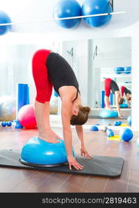 Bosu ball for fitness instructor woman in aerobics gym