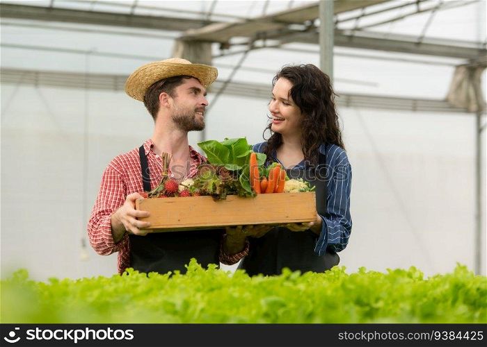 Both small business owners have organic vegetable gardens, They picking fresh veggies to deliver to consumers.