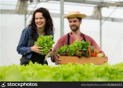 Both small business owners have organic vegetable gardens, They picking fresh veggies to deliver to consumers.