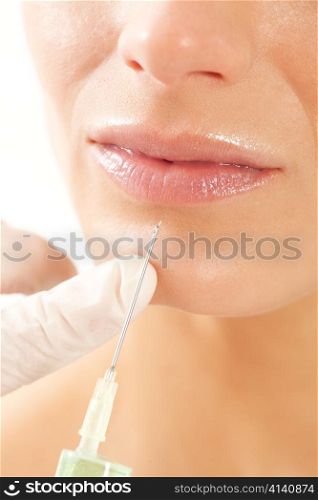 Botox - Age and beauty; a doctor is doing the injection