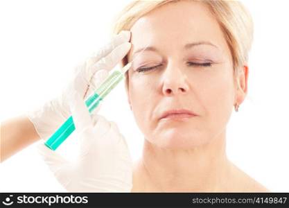 Botox - Age and beauty; a doctor is doing the injection