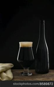 Bottle An Glass Of Craft Dark Stout Beer with Chocolate Flavor