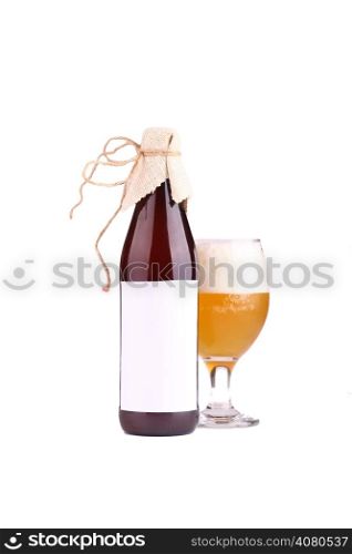 Bottle and glass of home brewed craft beer with blank label template isolated on white background