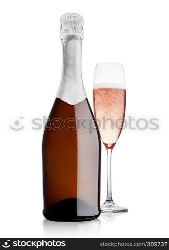 Bottle and glass of pink rose champagne on white background