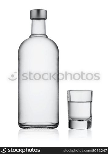 Bottle and glass of vodka isolated on white background. Bottle and glass of vodka