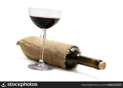 bottle and glass of wine isolated on white background