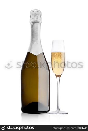 Bottle and glass of yellow champagne on white background