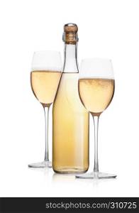 Bottle and glass of yellow champagne with bubbles on white background with reflection