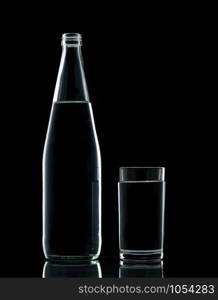 Bottle and Glass water clear isolate on over black background