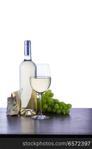 Bottle and glass with white wine in table. Glass of red wine