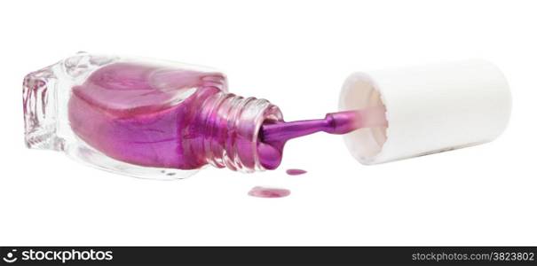 bottle and spilled purple nail polish isolated on white background
