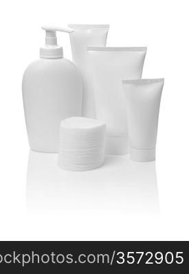 bottle and tubes with cotton pads