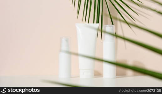 bottle, empty white plastic tubes for cosmetics. Packaging for cream, gel, serum, advertising and product promotion, mock up