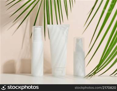 bottle, empty white plastic tubes for cosmetics. Packaging for cream, gel, serum, advertising and product promotion, mock up