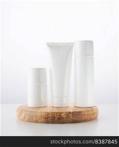 Bottle, empty white plastic tubes for cosmetics. Packaging for cream, gel, serum, advertising and product promotion, mock up
