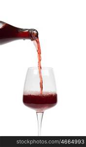 Bottle filling a glass of wine isolated on a white background