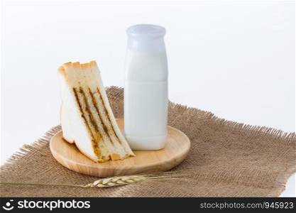 Bottle milk with sandwiches on white background.
